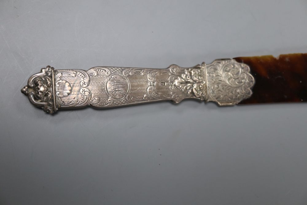 A Victorian silver handled tortoiseshell letter opener(a.f.) 25.6cm and a white metal and enamelled cigarette case, 83mm.